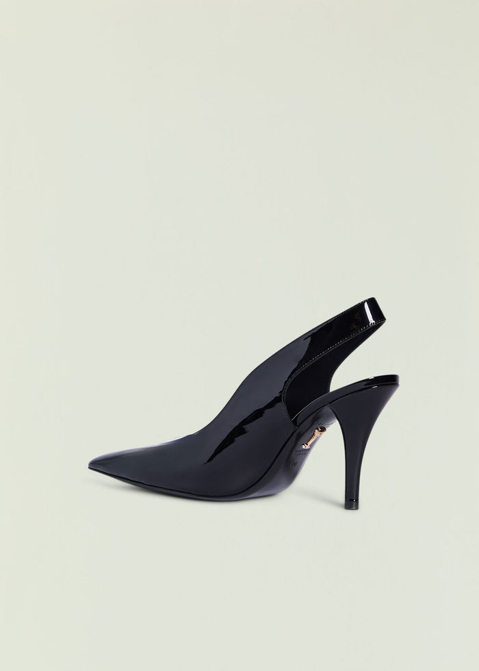 Side view of black patent Maxime Slingback Heel showing glossy finish and curved silhouette.