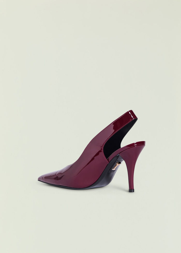 Maxime Slingback Heel in burgundy patent leather shown from the side with pointed toe and high heel