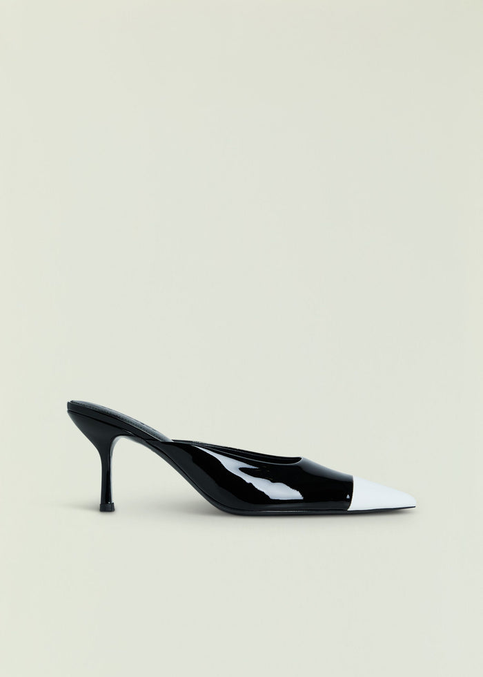 Allegra Leather Kitten Mule in black patent with white toe cap, side view.