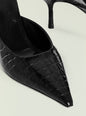 Close-up of a black crocodile-embossed kitten mule showing textured upper and pointed toe thumbnail image 4 of 4