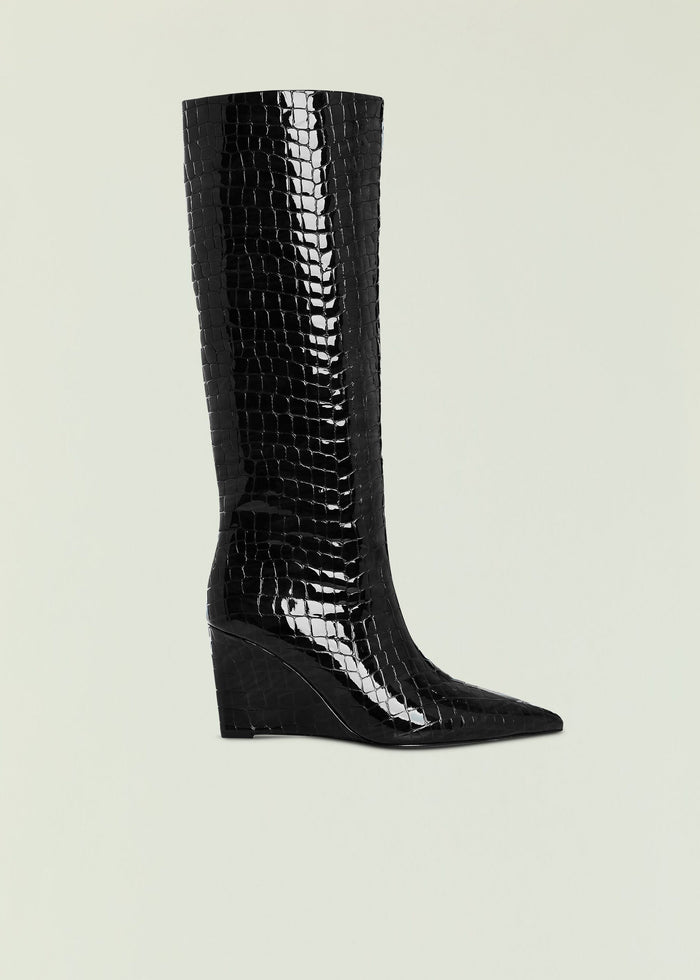 Natassa wedge boot in black crocodile-embossed leather with knee-high shaft.