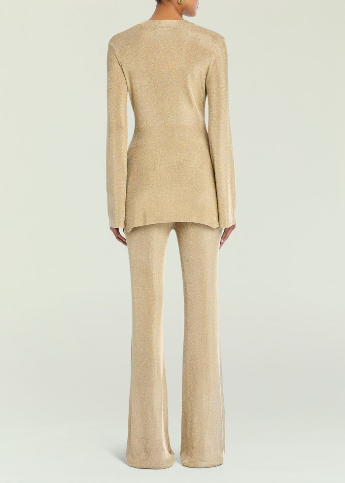 Back view of Ines Metallic Knit Top in champagne gold with long sleeves and matching knit pants