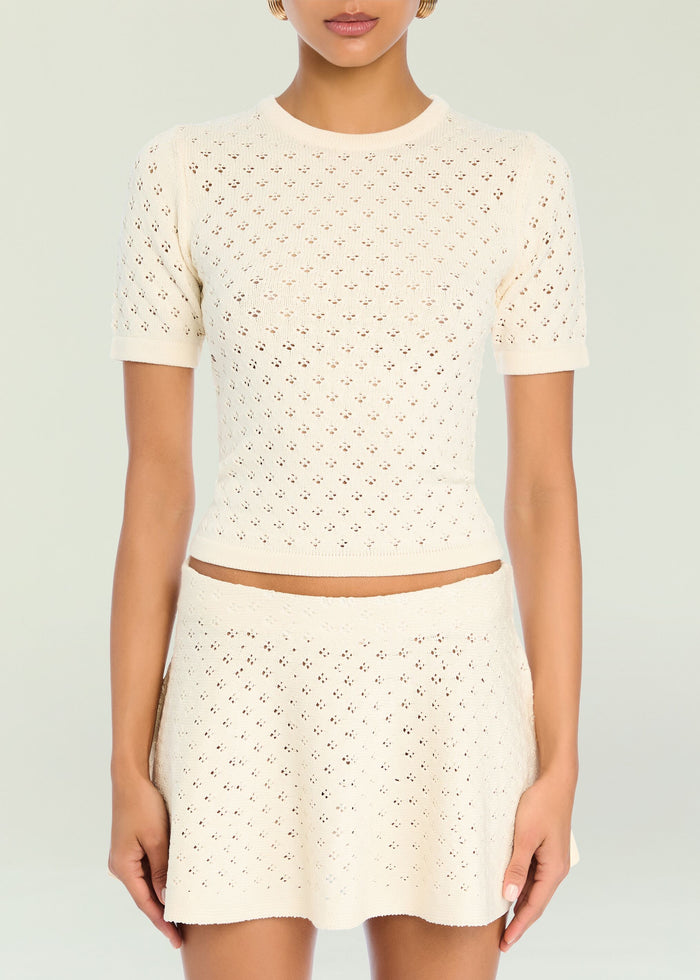 Cream Josie Pointelle Knit Top with short sleeves and a crew neck on a model.