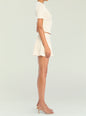 Side view of a model wearing the Josie Pointelle Knit Top in cream thumbnail image 3 of 5