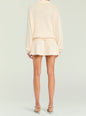 Back view of ivory pointelle knit pullover with relaxed fit and ribbed hem over matching knit shorts. thumbnail image 4 of 5