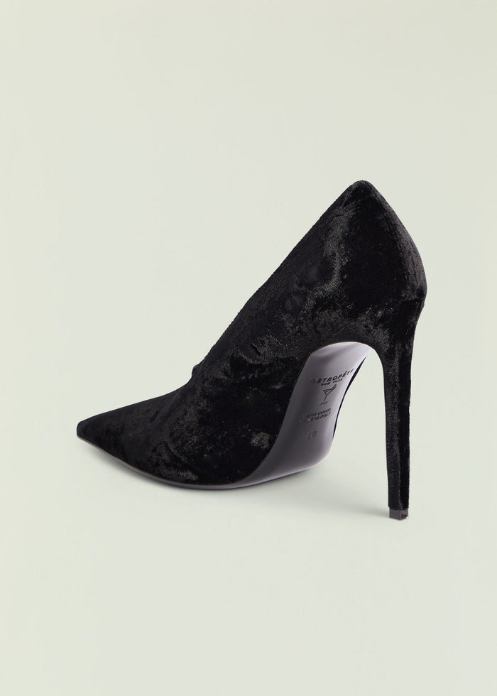 Black velvet Mollie Pump with a pointed toe and tall stiletto heel in a side view
