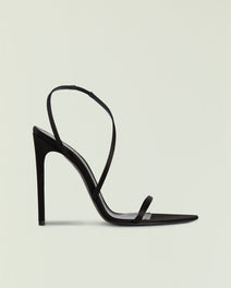 Black strappy high heel sandal with slim ankle strap and stiletto heel.