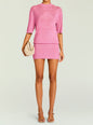 Front view of pink Rae Metallic Knit Mini Dress with short sleeves and a crew neckline, model carrying a beige woven bag thumbnail image 1 of 5
