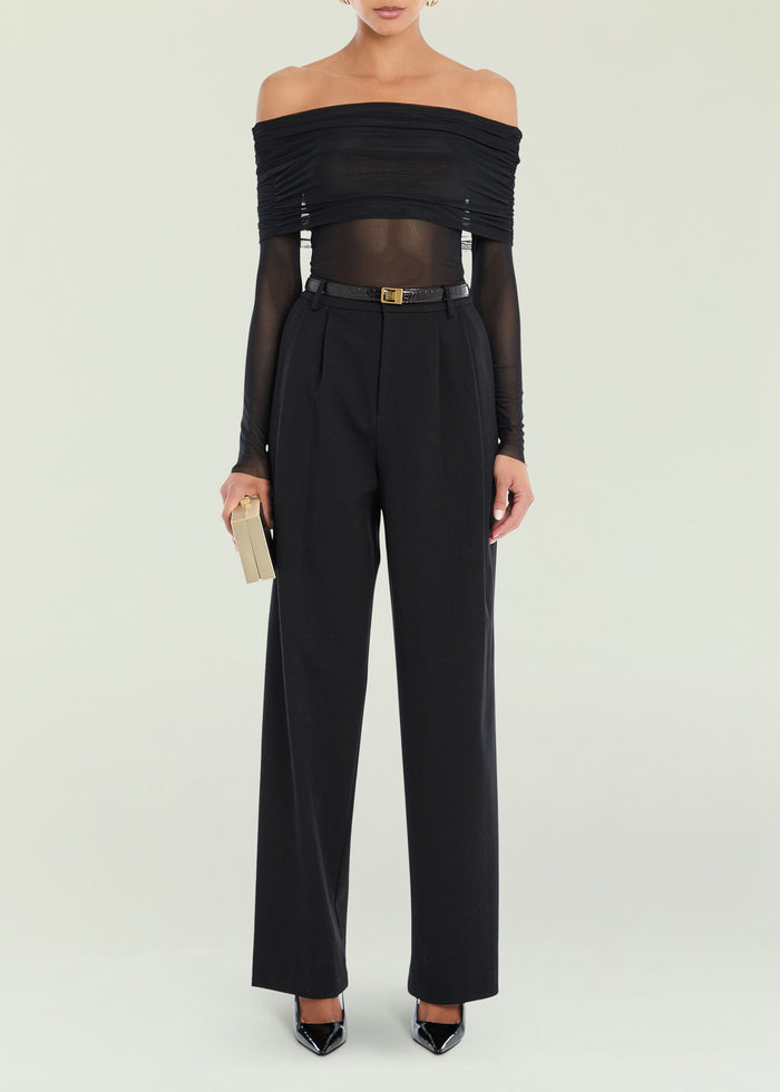 Rosa Top off the shoulder black top with ruched bodice and sheer sleeves paired with high waisted black trousers