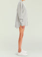 Side view of the gray Ayla Shacket on a model with rolled sleeves and mid thigh length thumbnail image 3 of 5