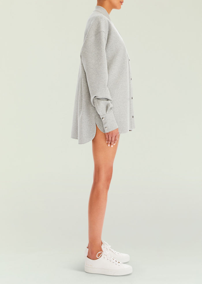 Side view of the gray Ayla Shacket on a model with rolled sleeves and mid thigh length