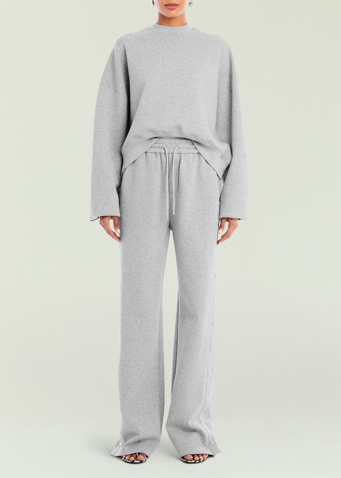 Front view of gray Calla Sweatshirt paired with matching drawstring sweatpants