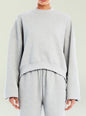 Front view of a model wearing a light grey Calla Sweatshirt with a relaxed fit thumbnail image 1 of 5
