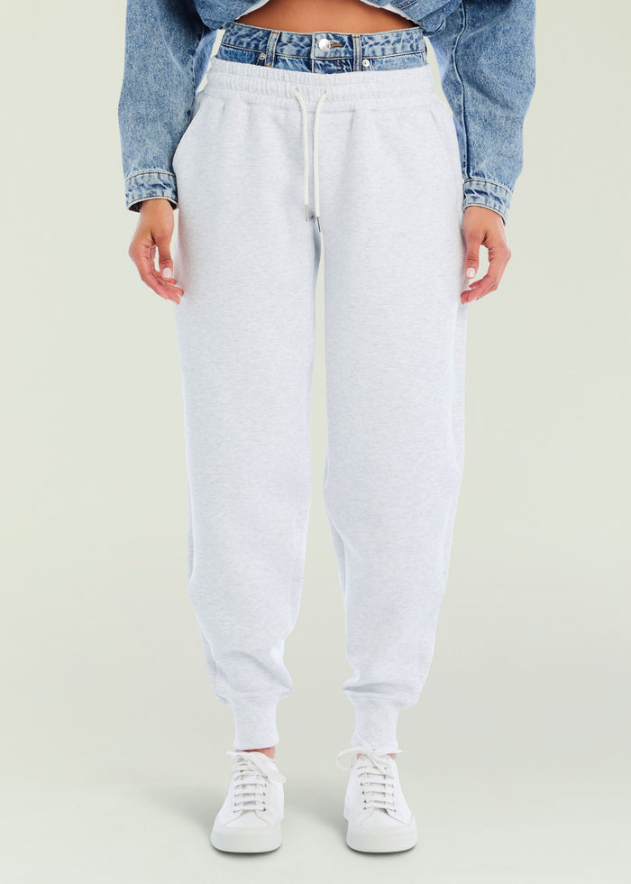Klara Sweatpant light gray drawstring joggers with a relaxed fit shown with a denim jacket