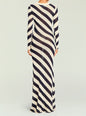 Back view of a navy and cream diagonal striped knit maxi dress with long sleeves. thumbnail image 4 of 5