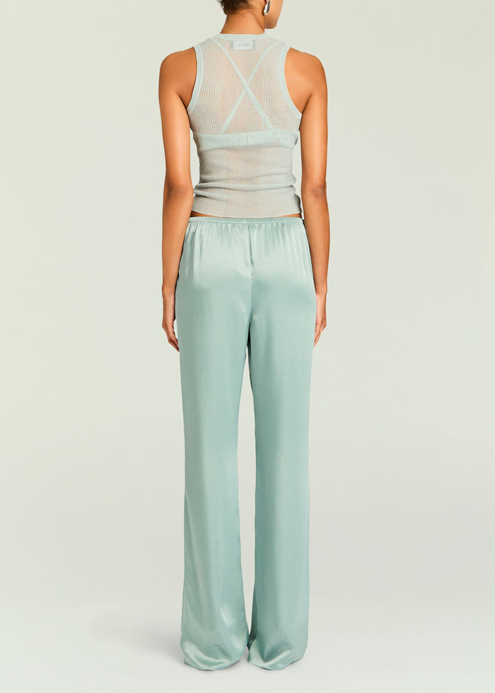 Back view of mint satin wide-leg pants with elastic waistband