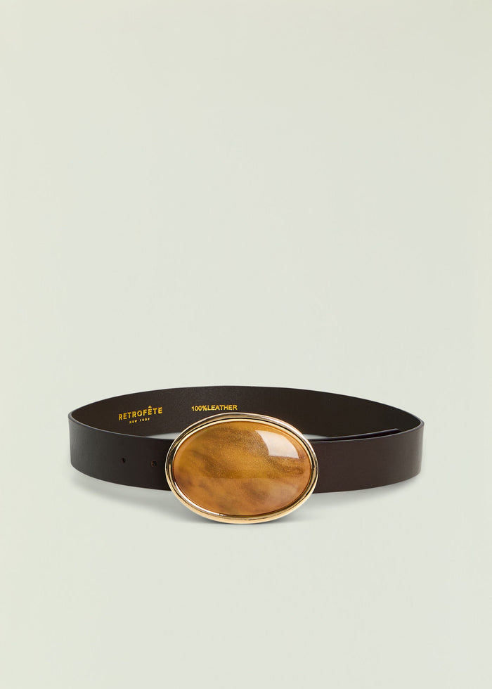 Dagmar belt with a large oval amber buckle on a black leather strap