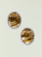 Large amber oval stone earring surrounded by a halo of clear crystals. thumbnail image 1 of 2