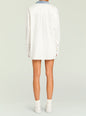 Back view of an oversized white shirt with a blue denim collar and center back pleat. thumbnail image 5 of 5