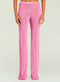 Bright pink metallic knit pants on a model, shown from waist to ankles thumbnail image 1 of 5