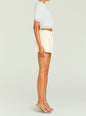 Side view of cream A-line skirt paired with a white and light blue striped knit crop top. thumbnail image 4 of 5
