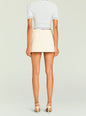 Back view of a model wearing a beige A-line skirt with belt loops and a light blue knit cropped top thumbnail image 5 of 5