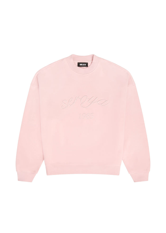 Powder pink Ryan Sweatshirt with ribbed collar cuffs and embossed script across the chest