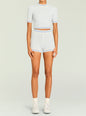 Front view of a model wearing a pale blue and cream knit cropped tee with matching high waist shorts thumbnail image 2 of 5