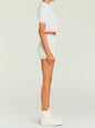 Side view of a model wearing a pale blue and cream knit cropped tee with matching shorts thumbnail image 5 of 5