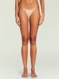 Front view of a nude thong panty worn by a model showing minimal coverage thumbnail image 3 of 5