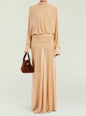 Beige Swan Maxi Dress with long sleeves and ruched waist worn with a brown handbag thumbnail image 1 of 5