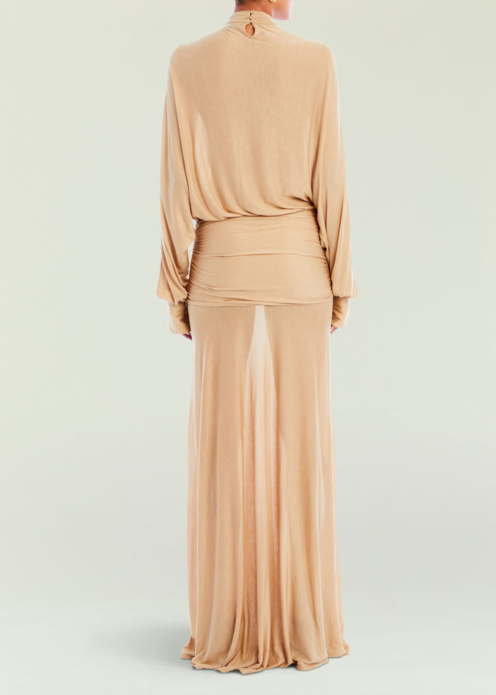 Back view of beige Swan Maxi Dress with a draped waist and small keyhole at the neckline.