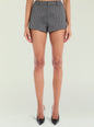Back view of a model wearing gray and black checkered high waisted shorts with black pointed toe heels. thumbnail image 1 of 5