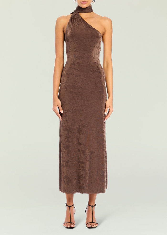 Brown velvet one shoulder midi dress with wrapped neck detail on a model