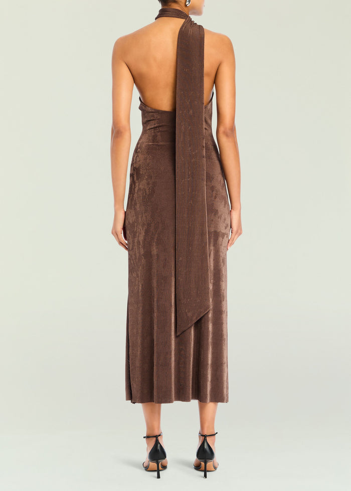 Back view of a chocolate brown Tre Midi Dress with a halter neck and long draped sash.