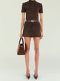 Front view of a model in a brown suede high neck top tucked into a matching mini skirt with a belt and handbag thumbnail image 5 of 5