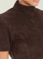 Close-up of dark brown suede top with a high neck on a model. thumbnail image 2 of 5