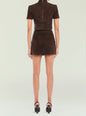 Back view of a brown suede short-sleeve top with a vertical center zipper. thumbnail image 4 of 5