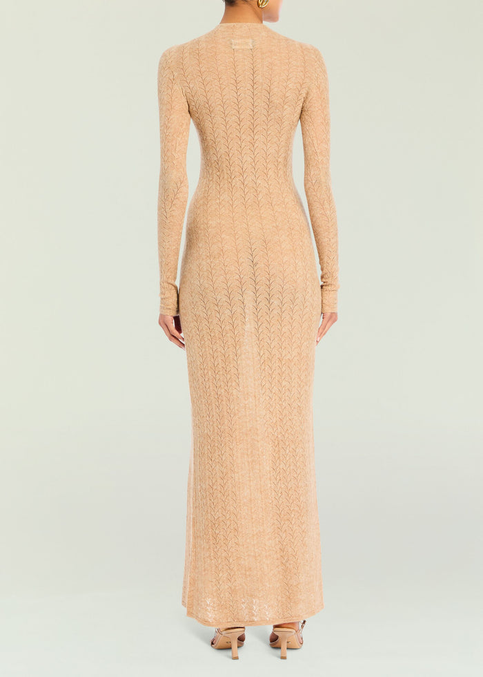 Back view of peach knit maxi dress showing the textured vertical leaf pattern and slim fit.