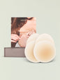 NOOD no show extra lift packaging with multiple white silicone nipple covers fanned beside the box. thumbnail image 1 of 2