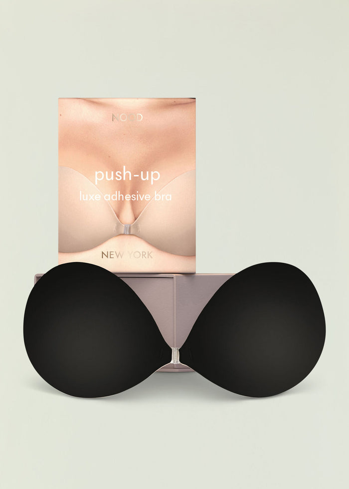 Push Up Luxe Adhesive Bra packaging with a close up of a nude bust on a pale background
