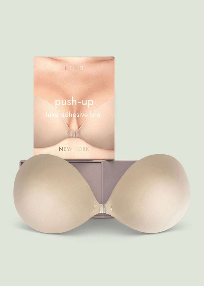 Push up luxe adhesive bra packaging featuring a close up of a nude beige bra