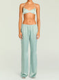 Front view of a pastel green satin Courtney Bralette with thin straps and a twisted center, paired with matching satin pants. thumbnail image 2 of 5