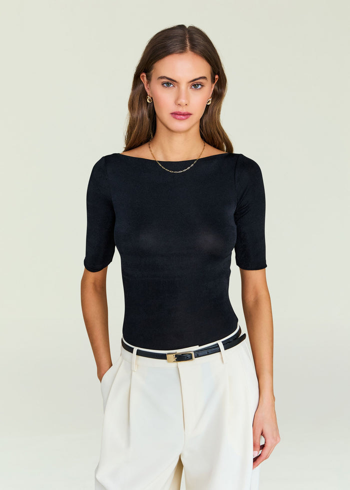Model wearing a black Panna Bodysuit with a fitted silhouette