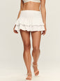 Front view of Isa Skirt highlighting the smocked high waist and two tiered ruffle hem worn with a white bikini top thumbnail image 4 of 5